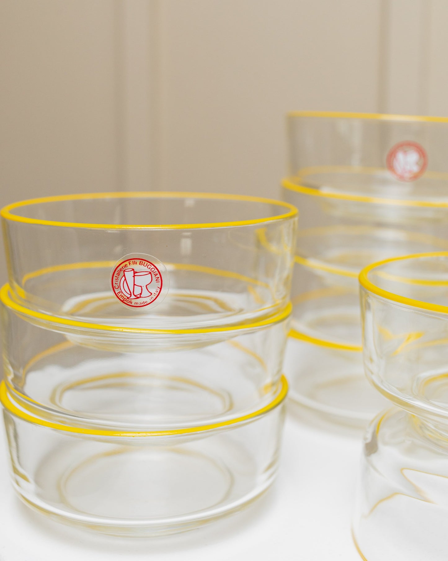 Set of 9 Empoli glass bowls 1980s clear glass with yellow rim Fratelli Buggiani Vintage