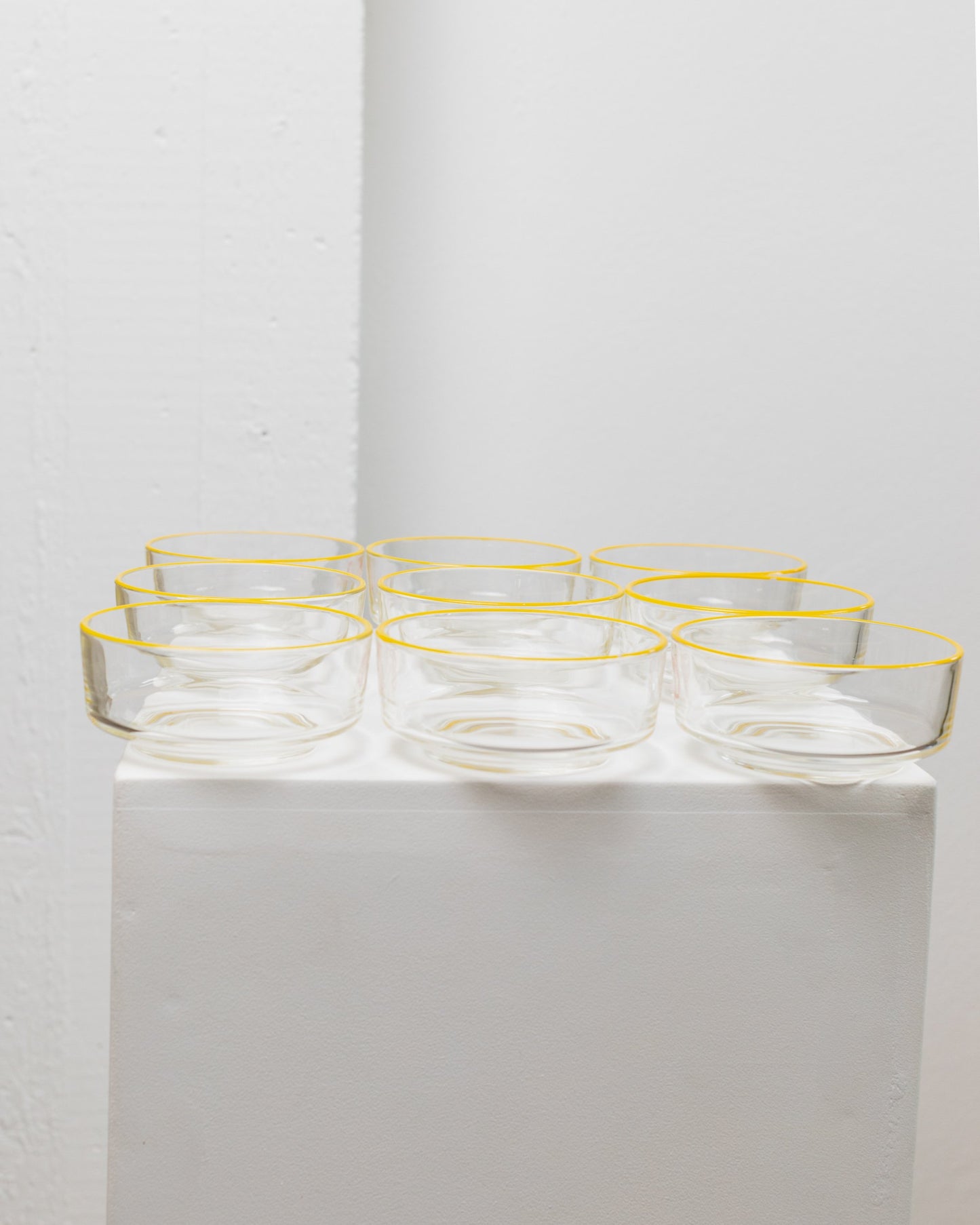 Set of 9 Empoli glass bowls 1980s clear glass with yellow rim Fratelli Buggiani Vintage