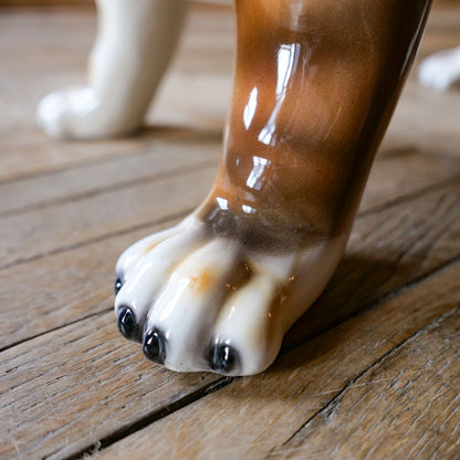 White ceramic bulldog sculpture with brown spots