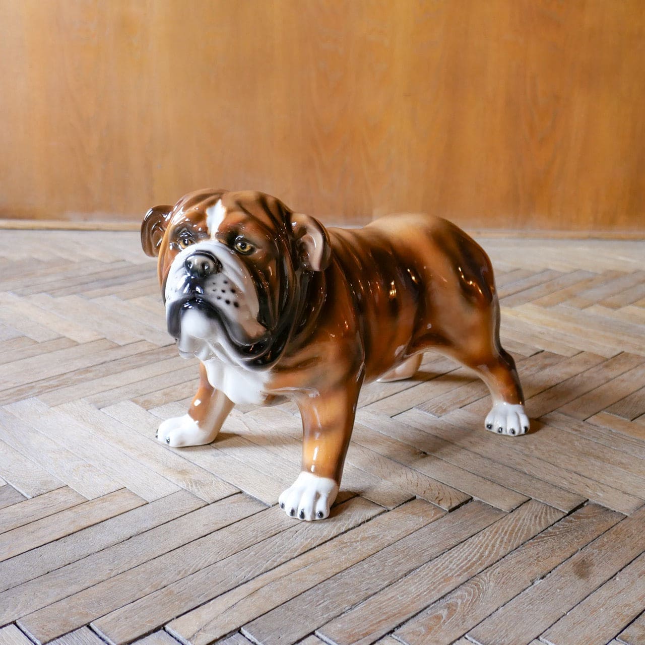 Brown and white ceramic bulldog sculpture