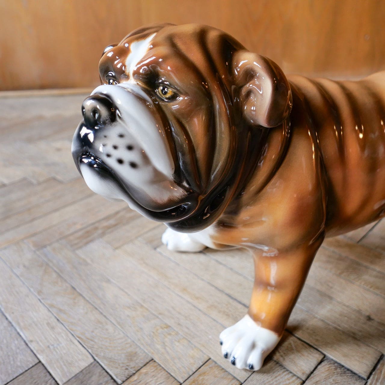 Brown and white ceramic bulldog sculpture