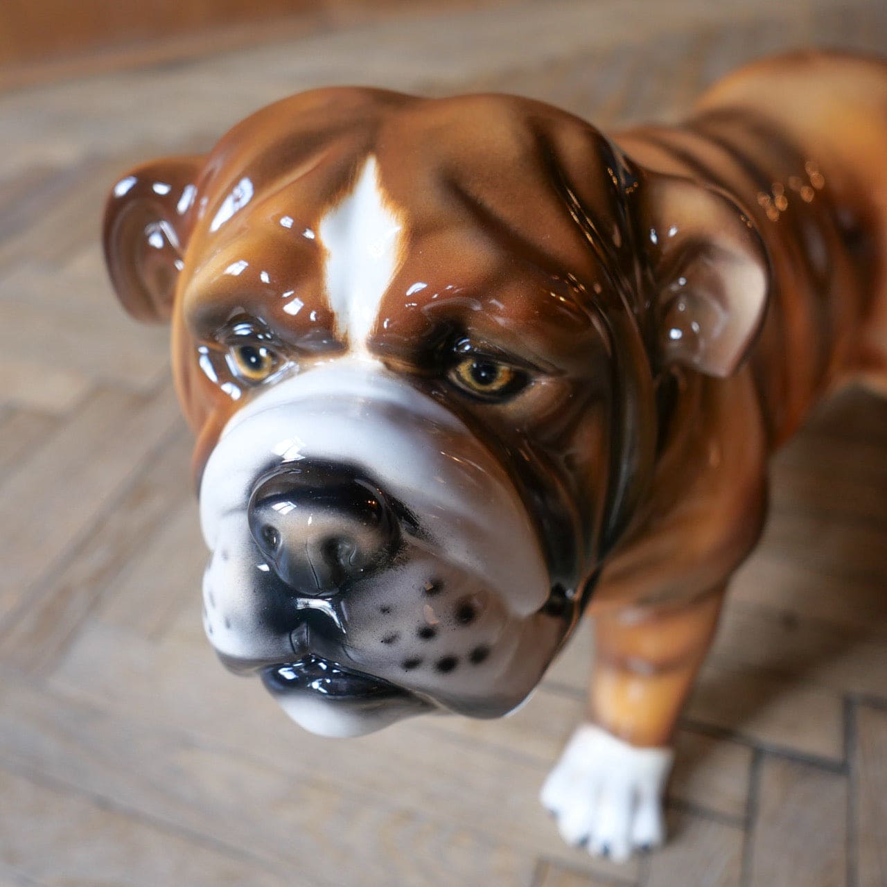 Brown and white ceramic bulldog sculpture