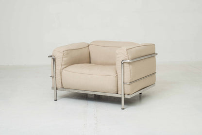 Cassina LC3 armchair by Le Corbusier in sand-colored fabric