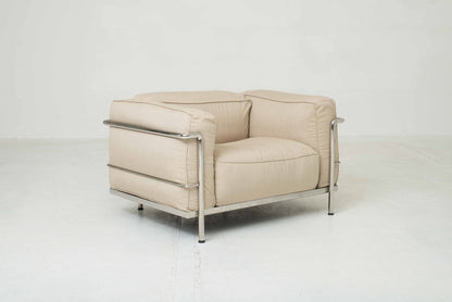 Cassina LC3 armchair by Le Corbusier in sand-colored fabric