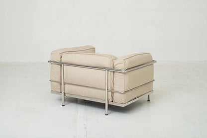 Cassina LC3 armchair by Le Corbusier in sand-colored fabric