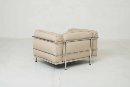 Cassina LC3 armchair by Le Corbusier in sand-colored fabric