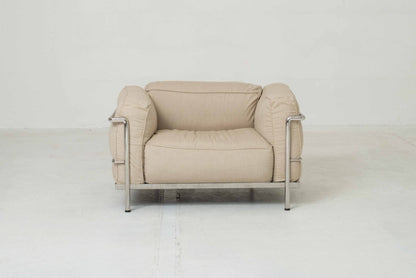 Cassina LC3 armchair by Le Corbusier in sand-colored fabric