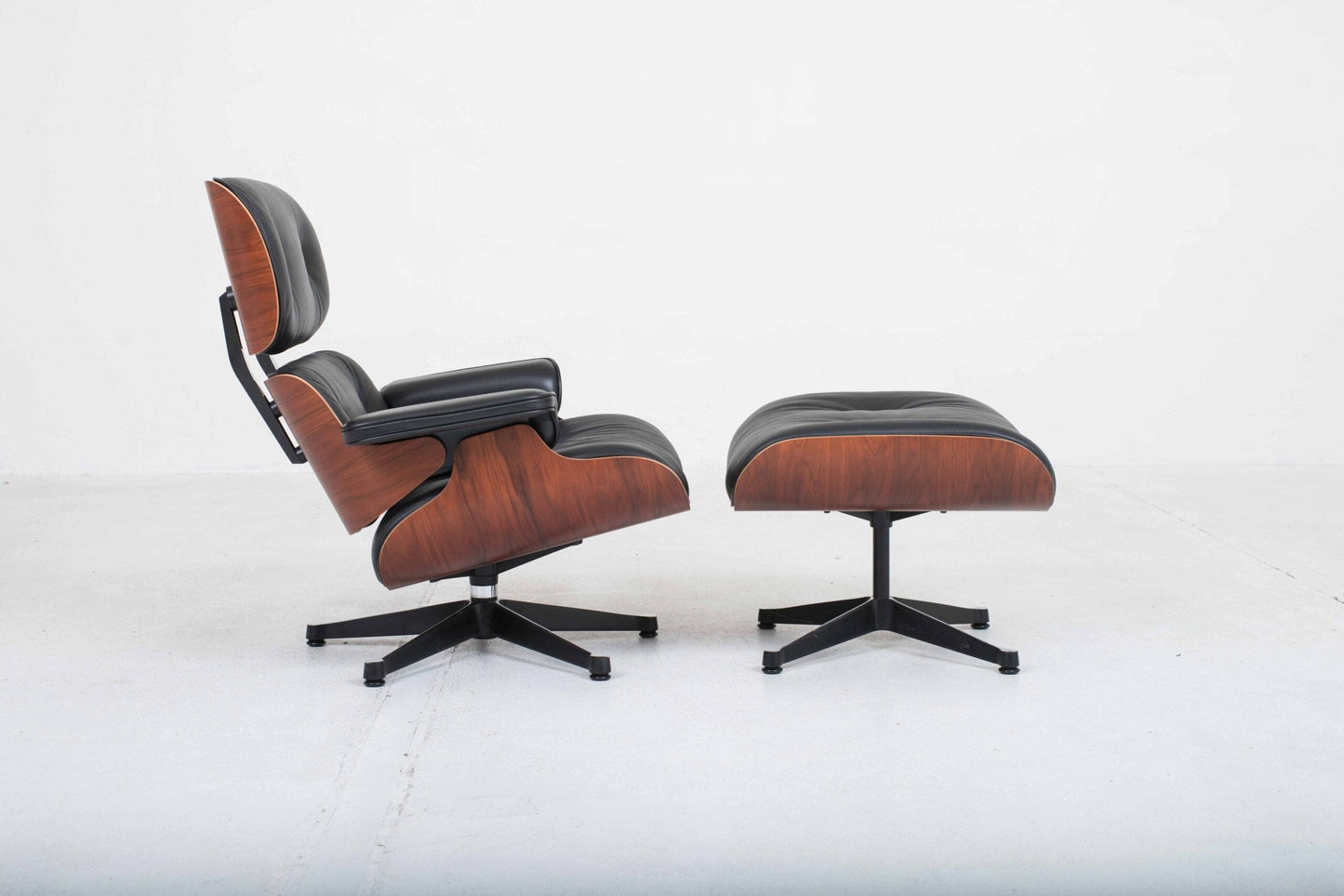 Vitra 670 Lounge Chair and Ottoman by Charles and Ray Eames, classic dimensions and rosewood