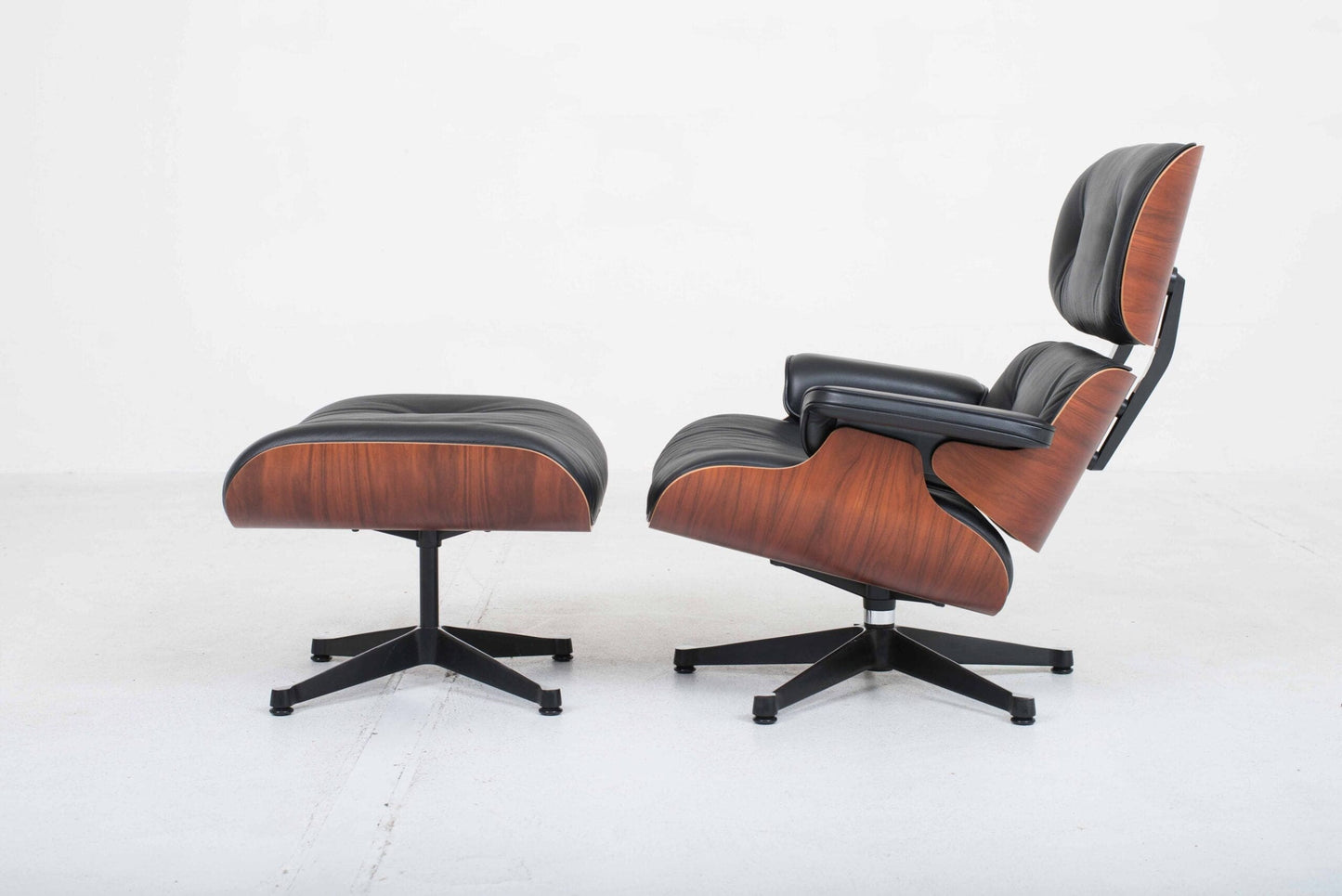 Vitra 670 Lounge Chair and Ottoman by Charles and Ray Eames, classic dimensions and rosewood