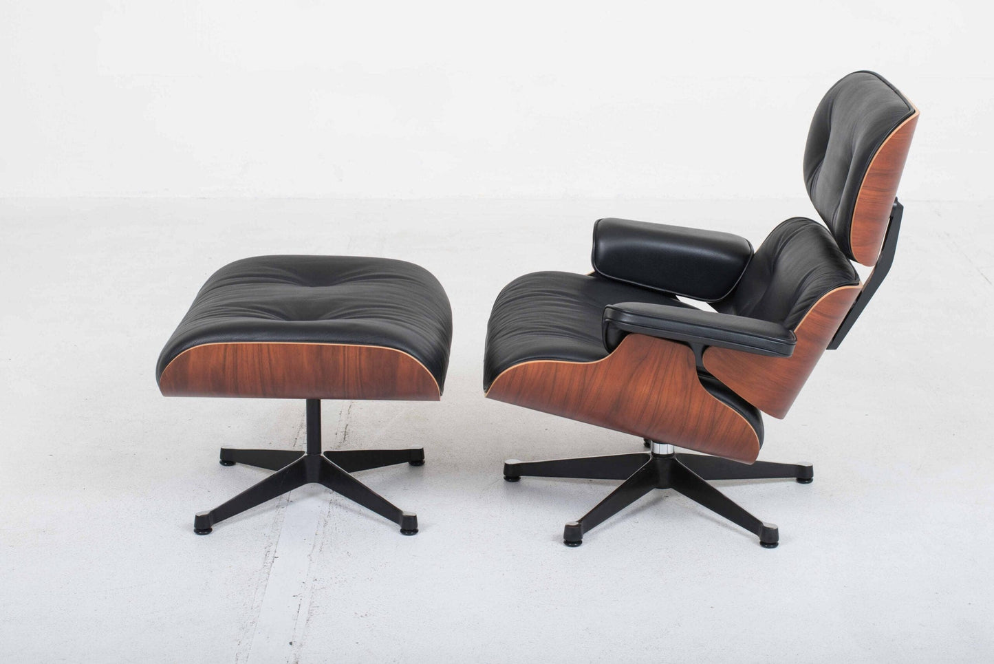 Vitra 670 Lounge Chair and Ottoman by Charles and Ray Eames, classic dimensions and rosewood