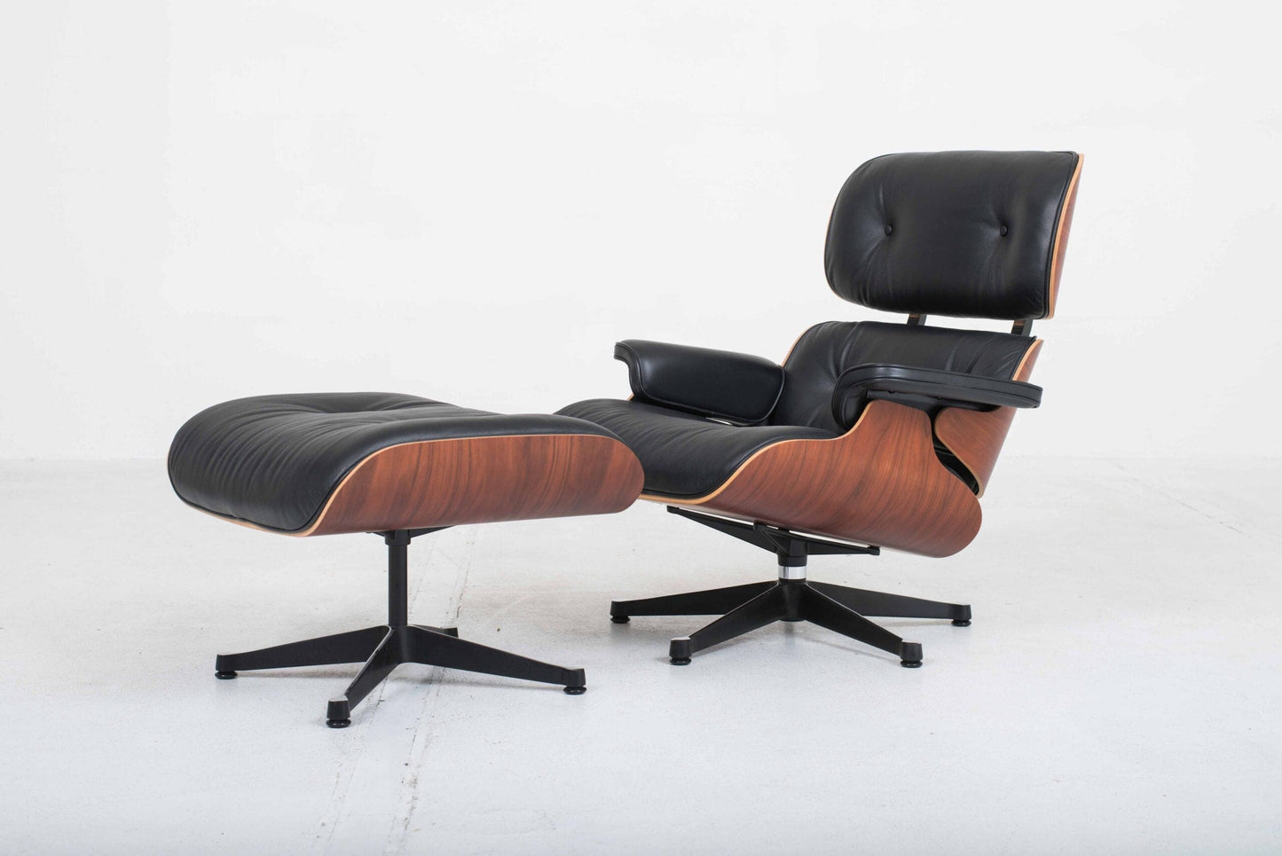 Vitra 670 Lounge Chair and Ottoman by Charles and Ray Eames, classic dimensions and rosewood