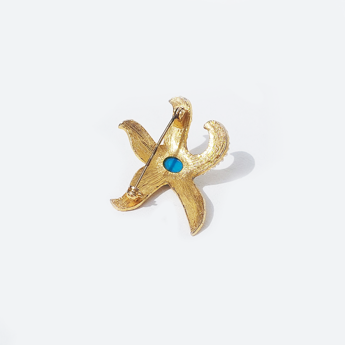 Broche étoile de mer : Design unique en or et bleu