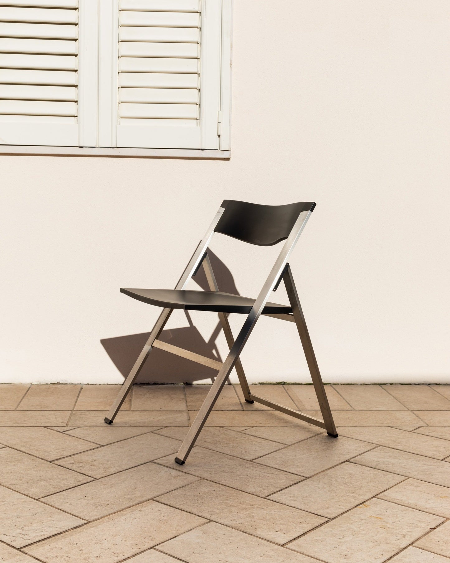 Tecno folding chair P08 design Justus Kolberg steel and black plastic Made in Italy 1990s Vintage