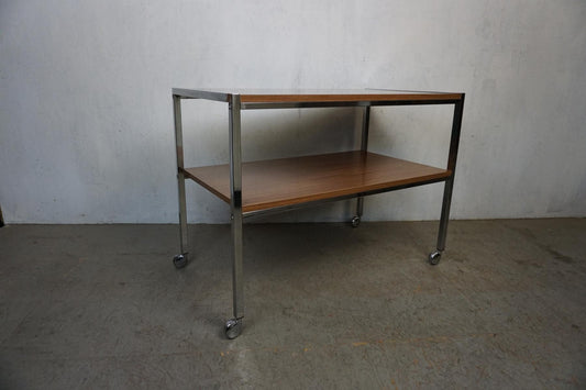 Serving trolley with chrome frame and Formica shelves in walnut decor vintage