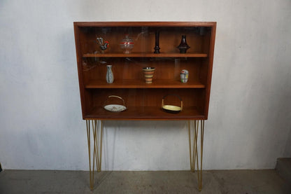 Noble teak display cabinet on golden hairpin legs vintage