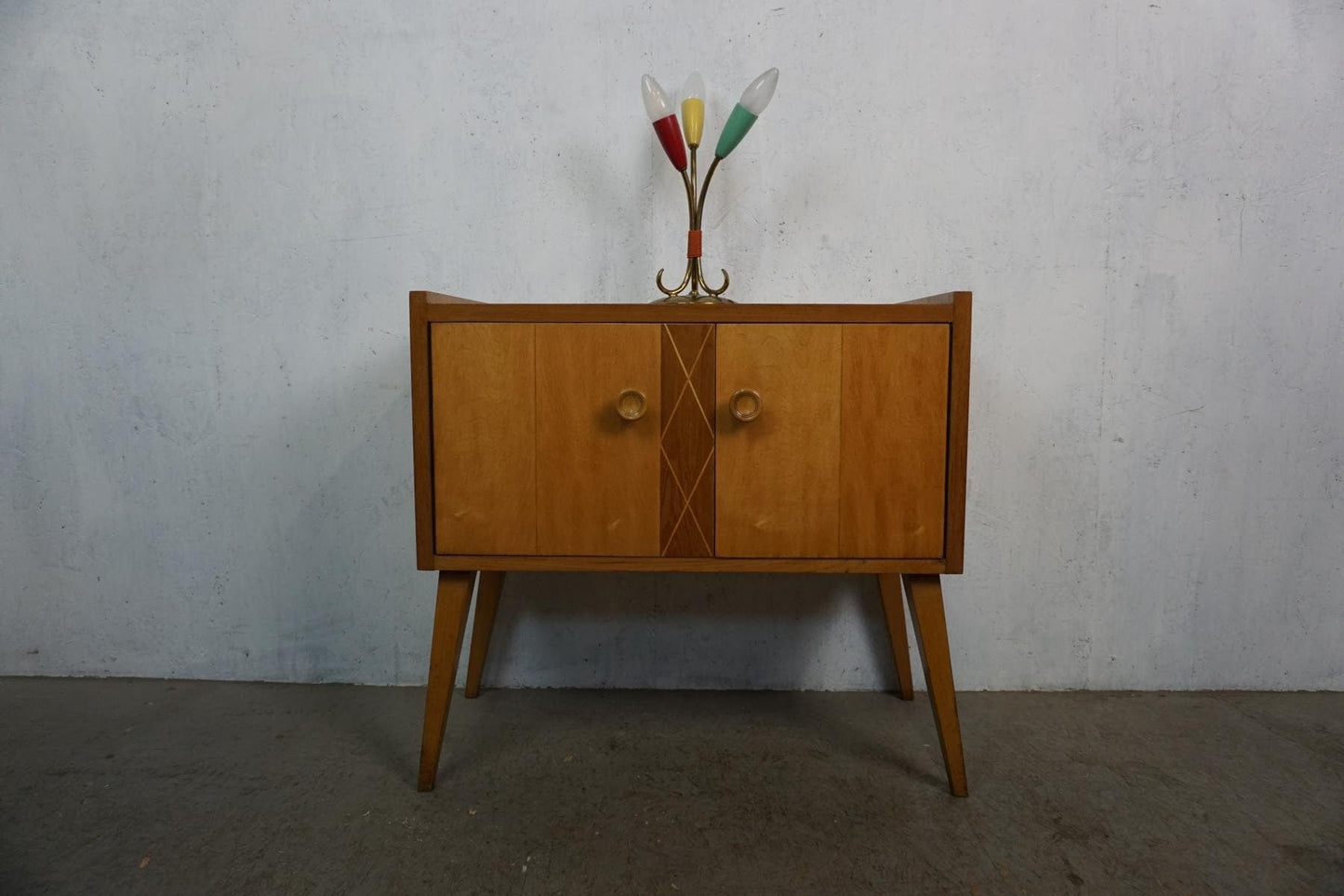 Stylish mid-century cabinet in light wood vintage