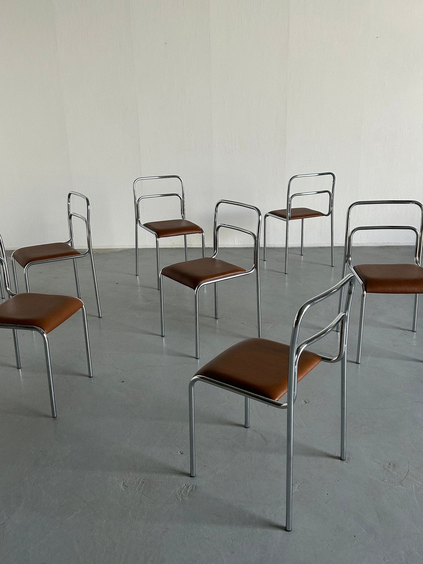 Bauhaus design chrome tubular steel and brown faux leather dining chairs, 1980s Italian modernist stackable dining chairs vintage