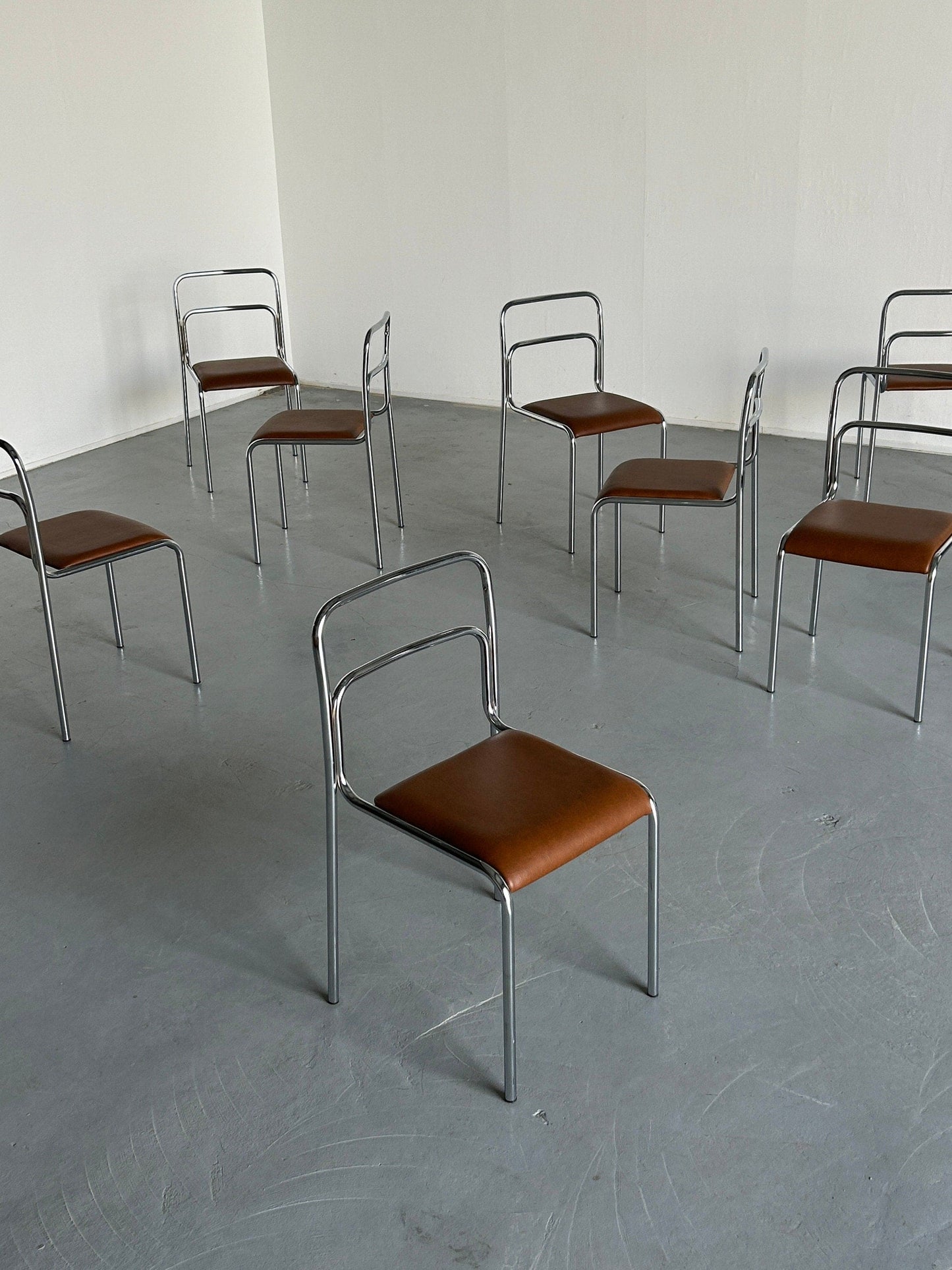 Bauhaus design chrome tubular steel and brown faux leather dining chairs, 1980s Italian modernist stackable dining chairs vintage