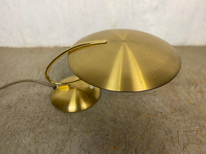 Extravagant designer lamp in vintage brass