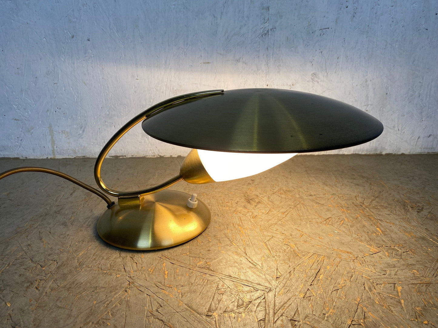 Extravagant designer lamp in vintage brass