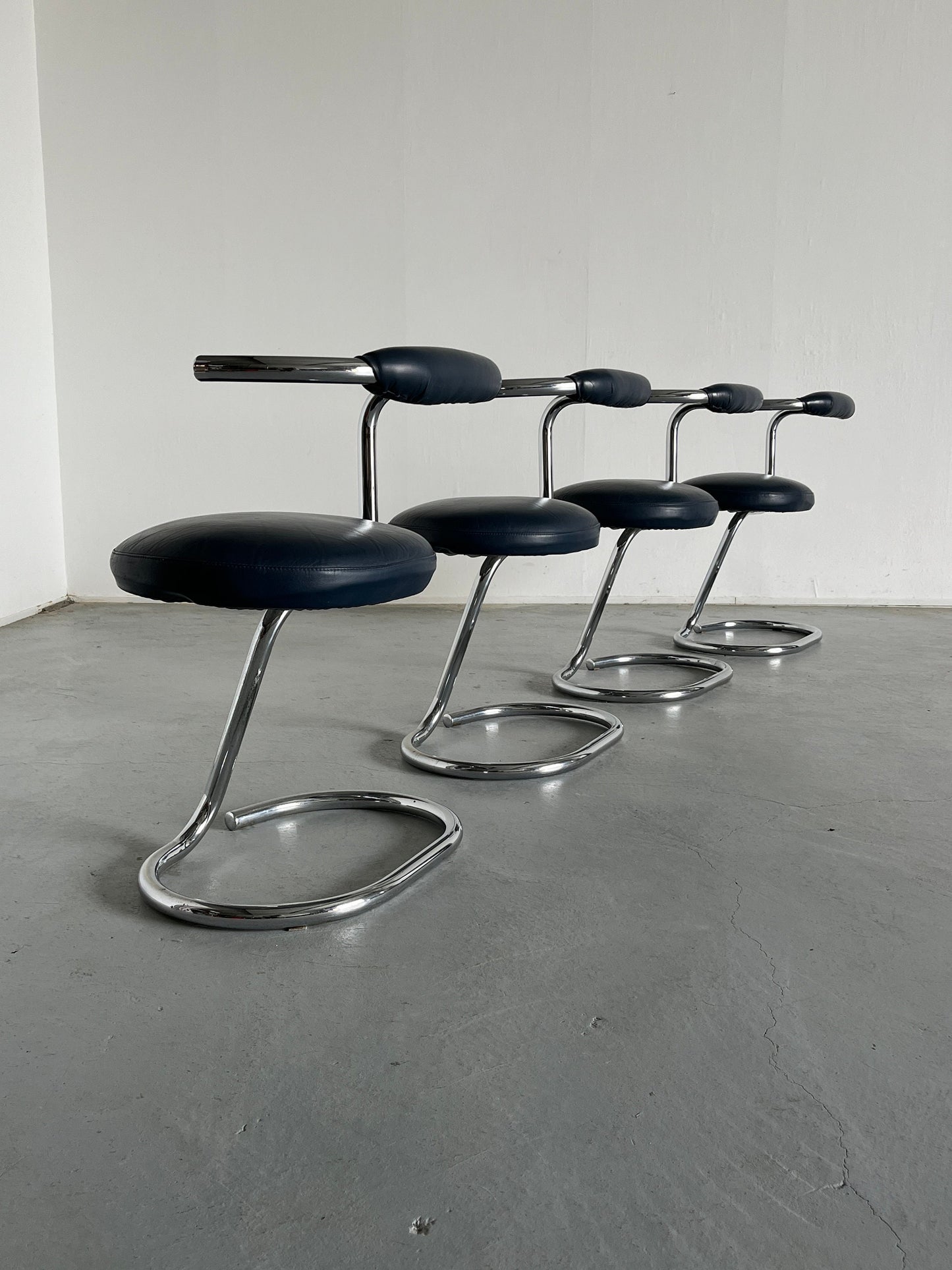 Set of 4 'Cobra' chairs by Giotto Stoppino in dark blue imitation leather, 1970s Italy Vintage