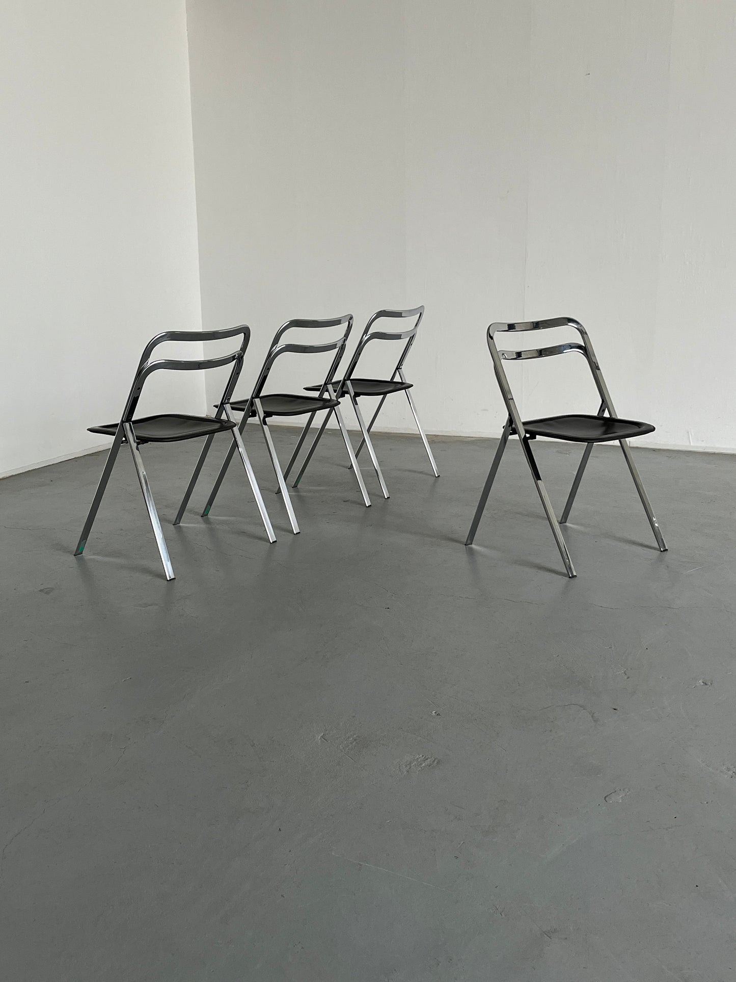 Set of 4 mid-century “Clio” folding chairs by Giorgio Cattelan for Cidue in leather and chrome, Italy 1970s vintage