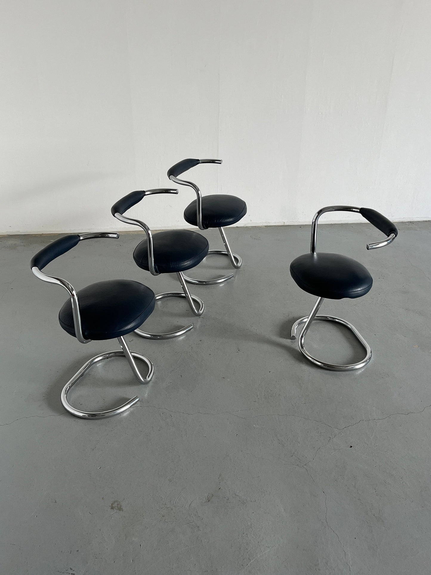 Set of 4 'Cobra' chairs by Giotto Stoppino in dark blue imitation leather, 1970s Italy Vintage