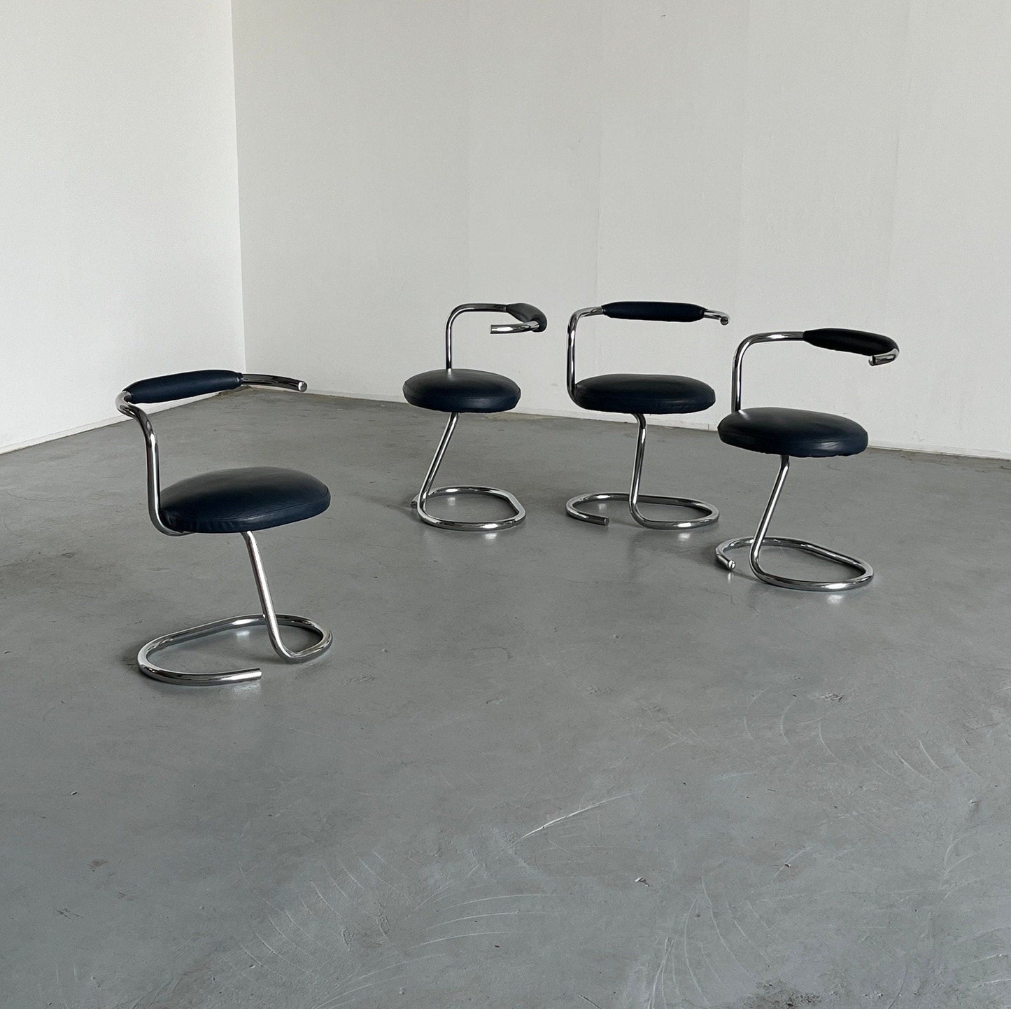 Set of 4 'Cobra' chairs by Giotto Stoppino in dark blue imitation leather, 1970s Italy Vintage