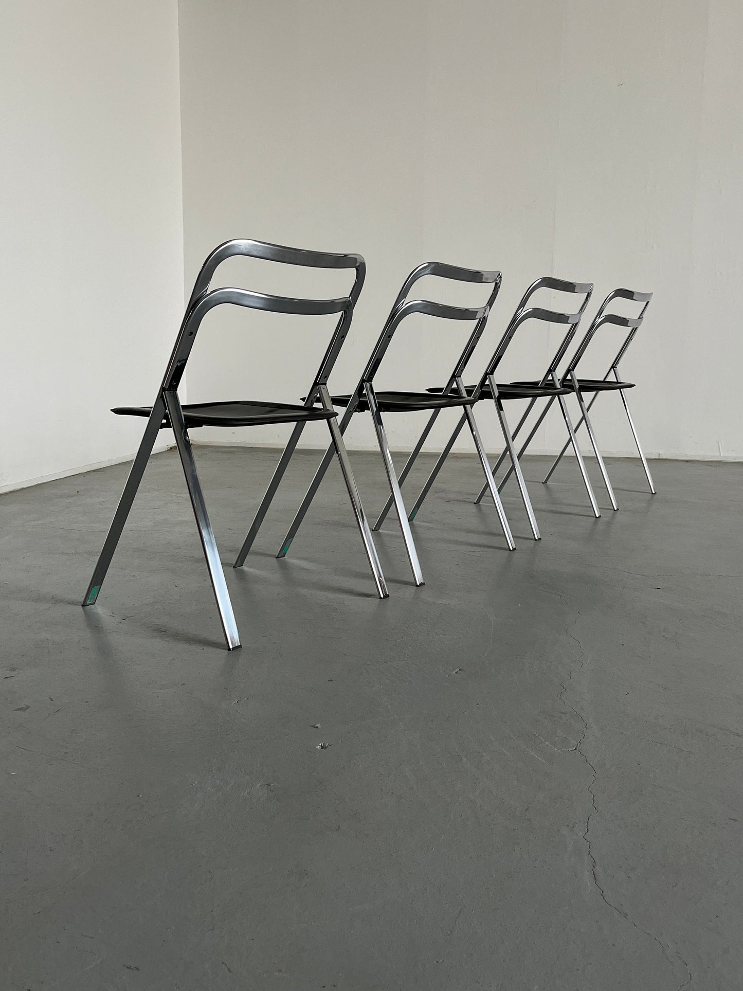 Set of 4 mid-century “Clio” folding chairs by Giorgio Cattelan for Cidue in leather and chrome, Italy 1970s vintage