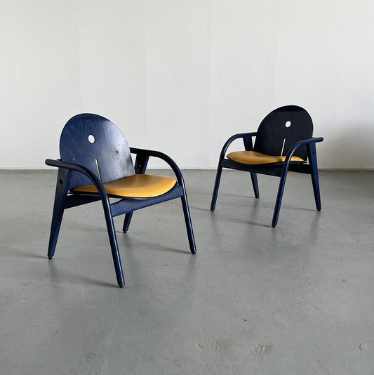 1 of 2 French postmodern armchairs by Baumann in dark blue wood and yellow imitation leather, 1980s vintage