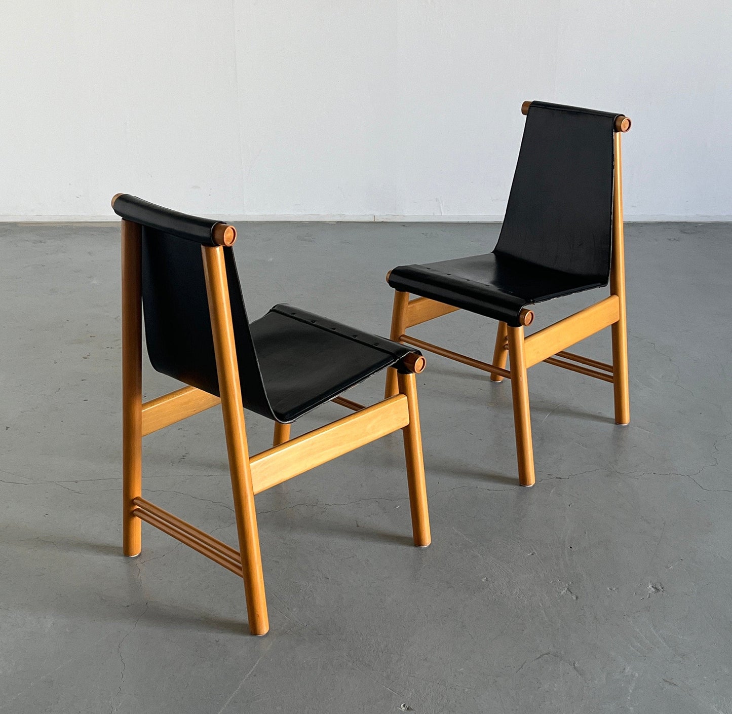 Set of 2 Italian sculptural Mid-Century Modern dining chairs, black leather and wood, Italy 1970s vintage