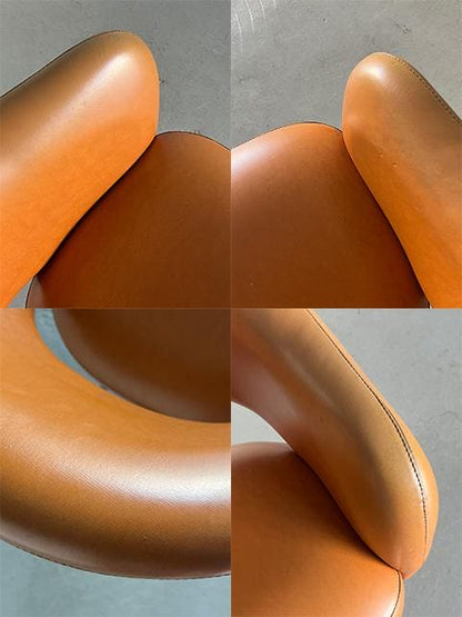 Mid-Century Modern Armchair in the style of Eero Saarinen, brown imitation leather and chrome-plated steel, 1980s Vintage