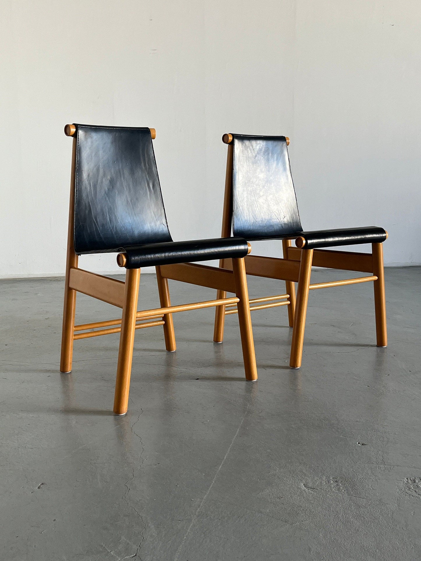 Set of 2 Italian sculptural Mid-Century Modern dining chairs, black leather and wood, Italy 1970s vintage