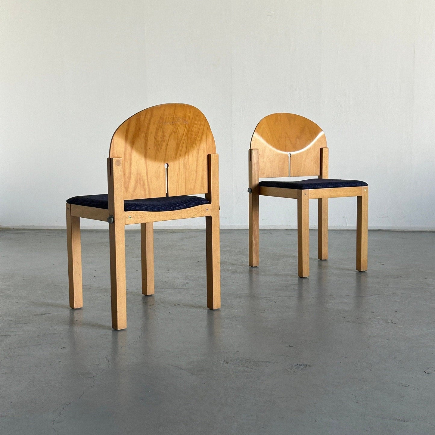 Set of 2 postmodern sculptural stackable wooden dining chairs by Arno Votteler for Bisterfeld and Weiss, Germany 1980 Vintage