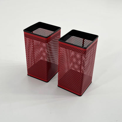 Red perforated trash can