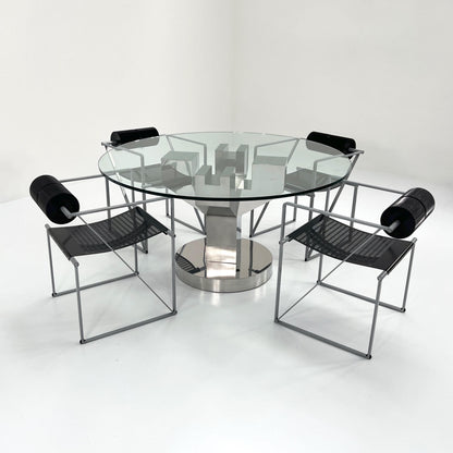 Structural dining table with chrome legs and glass top, 1970s vintage