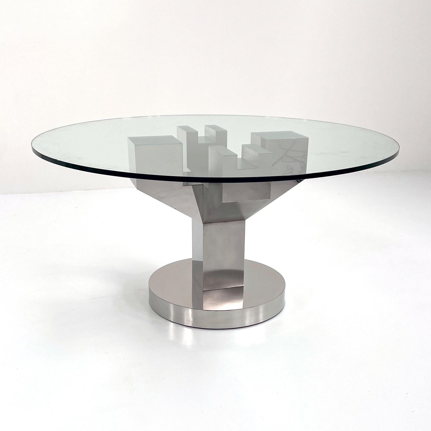 Structural dining table with chrome legs and glass top, 1970s vintage