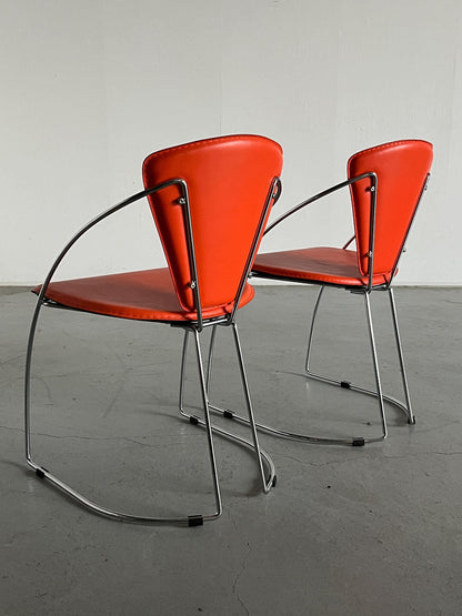 1 of 2 Postmodern orange dining chairs in the style of the Linda chair by Arrben, imitation leather and chromed steel, 1990s Italy