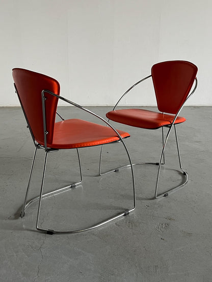 1 of 2 Postmodern orange dining chairs in the style of the Linda chair by Arrben, imitation leather and chromed steel, 1990s Italy