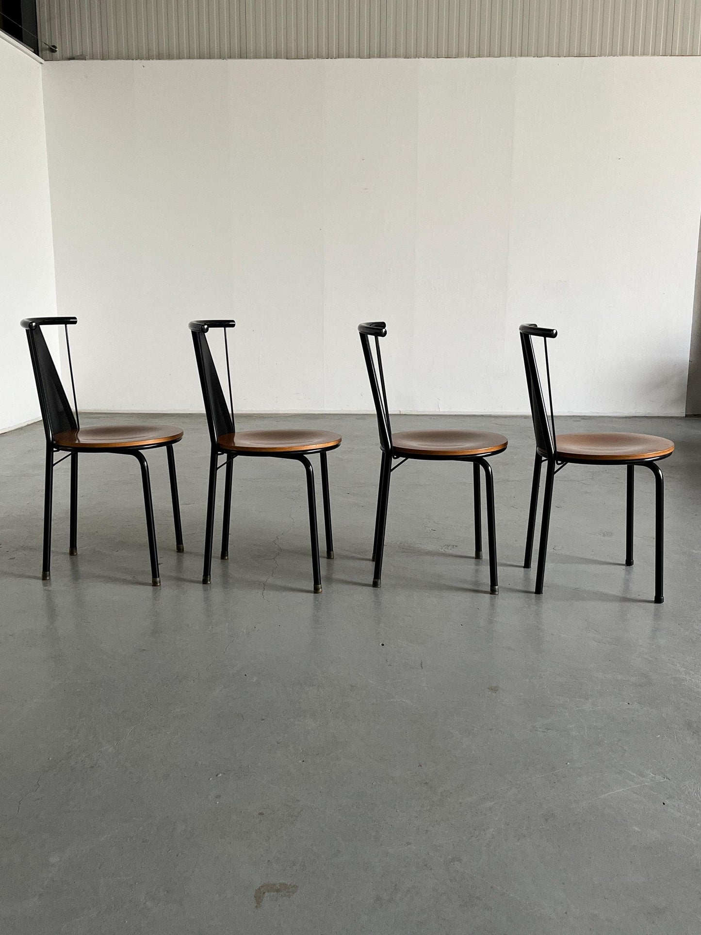 1 of 8 Postmodern Sculptural Vintage Dining Chairs in Black Metal with Round Wooden Seats, 1980s Italy