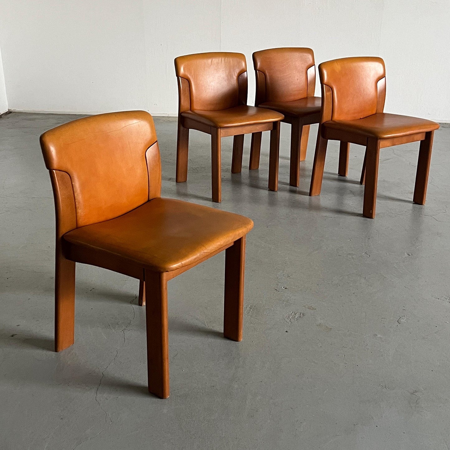 Set of 4 Vintage Mid-Century Modern Dining Chairs, Cognac Leather and Wood, in the style of Silvio Coppola, 1970s Italy