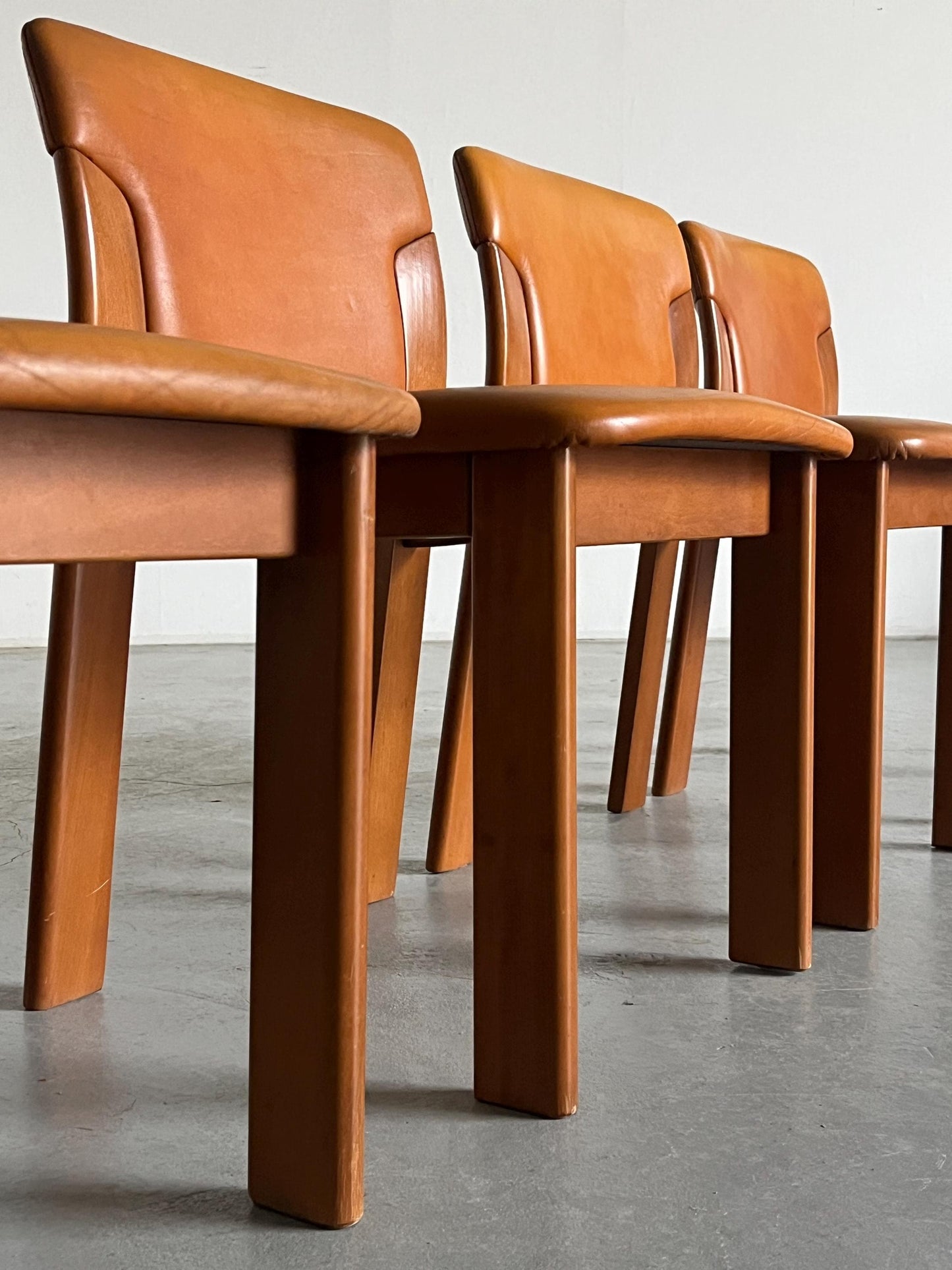 Set of 4 Vintage Mid-Century Modern Dining Chairs, Cognac Leather and Wood, in the style of Silvio Coppola, 1970s Italy