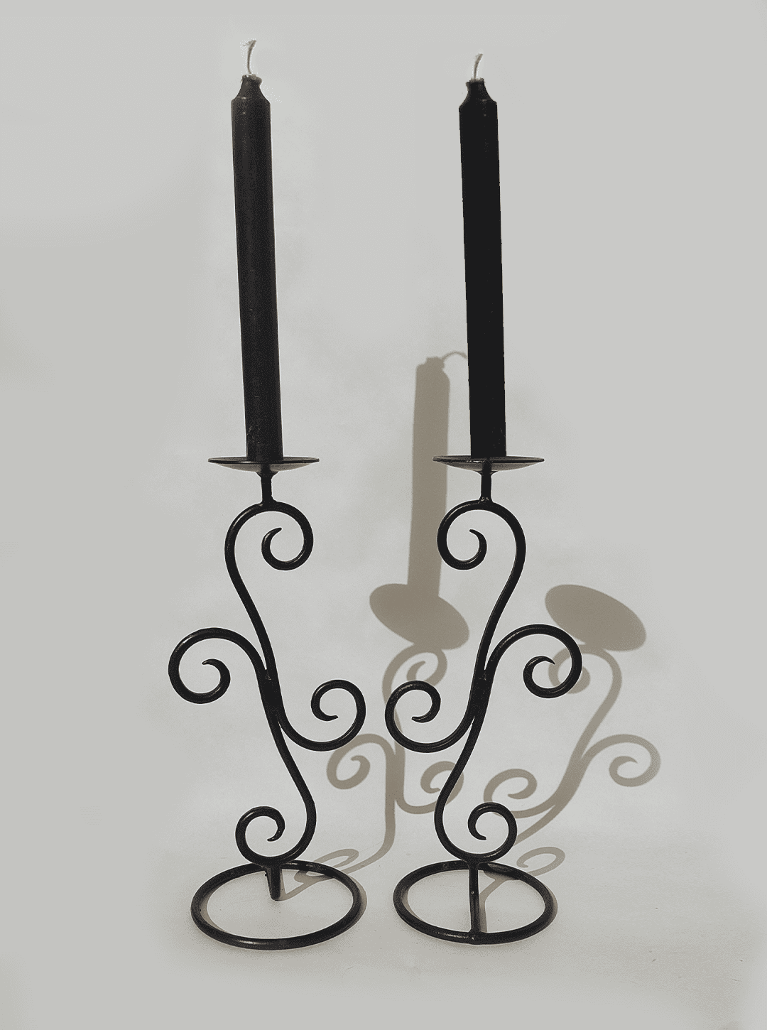 Spiral-shaped vintage wrought iron candle holder pair