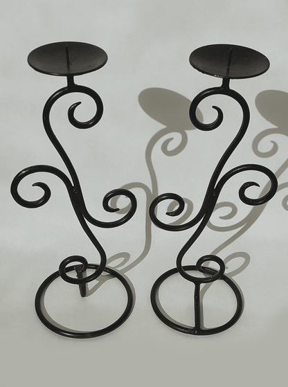 Spiral-shaped vintage wrought iron candle holder pair