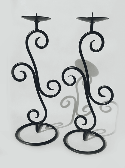 Spiral-shaped vintage wrought iron candle holder pair