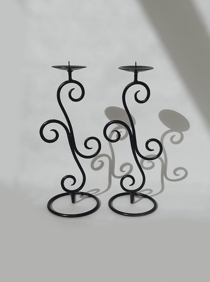 Spiral-shaped vintage wrought iron candle holder pair