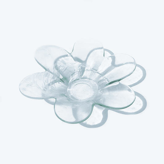 Transparent vintage glass bowl in flower shape