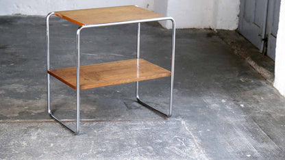 Tubular steel side table with veneered wooden shelves