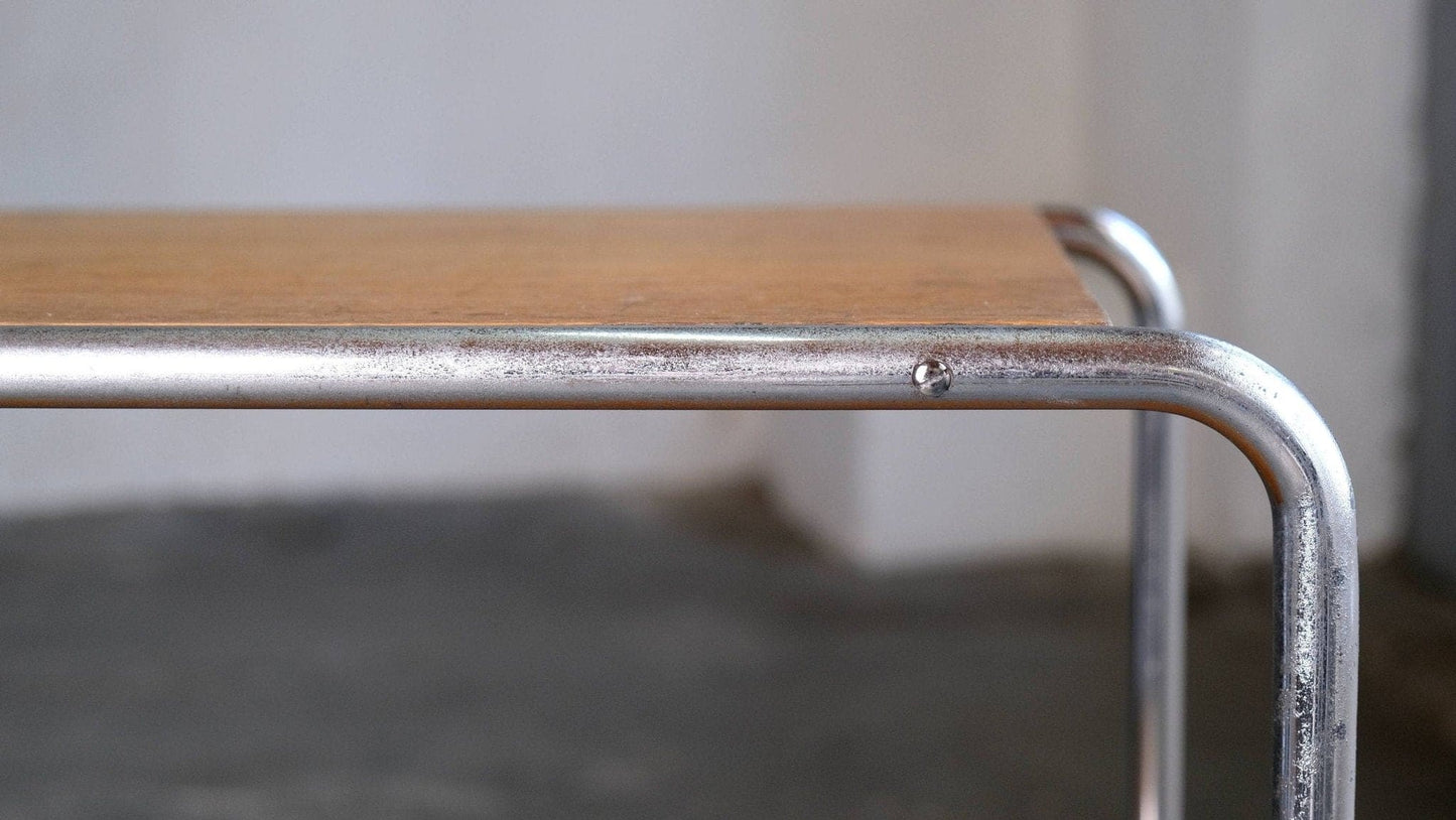 Tubular steel side table with veneered wooden shelves