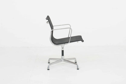 Eames EA 108 office chair by Vitra with black mesh and polished aluminum Vintage